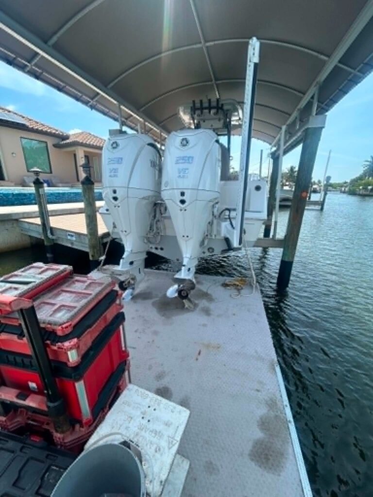 Twin Yamaha 300 outboards serviced dockside over a Southwest Florida canal