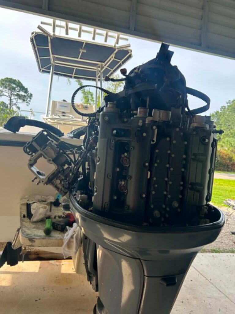 Yamaha 250 outboard with the cowling removed for a powerhead teardown by a mobile marine mechanic in Fort Myers